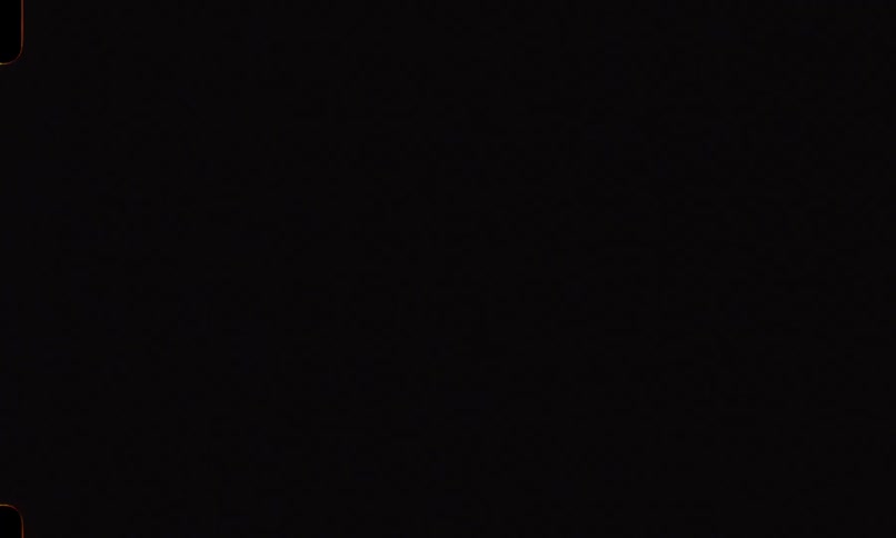 Vintage 8mm footage captures a passing subway train filled with silhouetted passengers in the dark of night