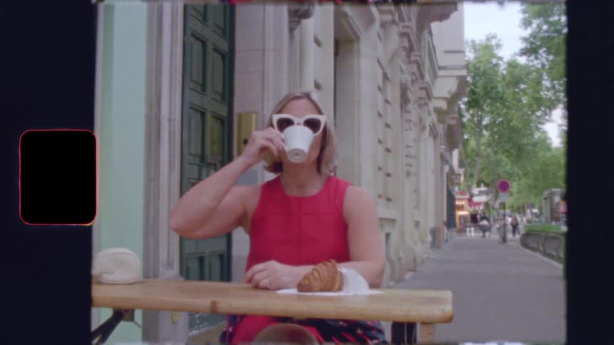Vintage 8mm film footage of a stylish woman drinking coffee at an outdoor cafe in Paris