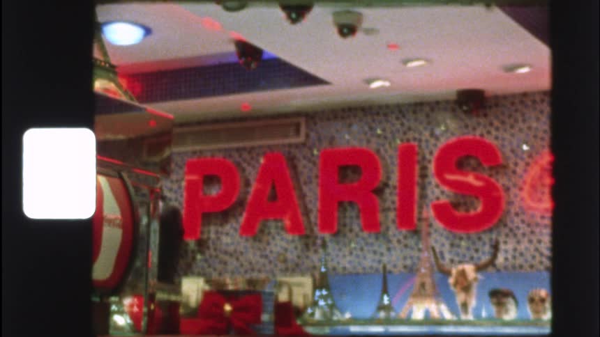 Vintage Super 8 footage showcases a collection of diverse typography and signage, all spelling out the word 'Paris'