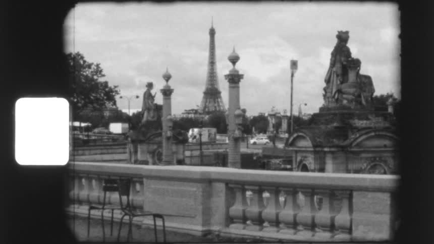 A classic black and white film reel shows the iconic Eiffel Tower and city life in Paris, France