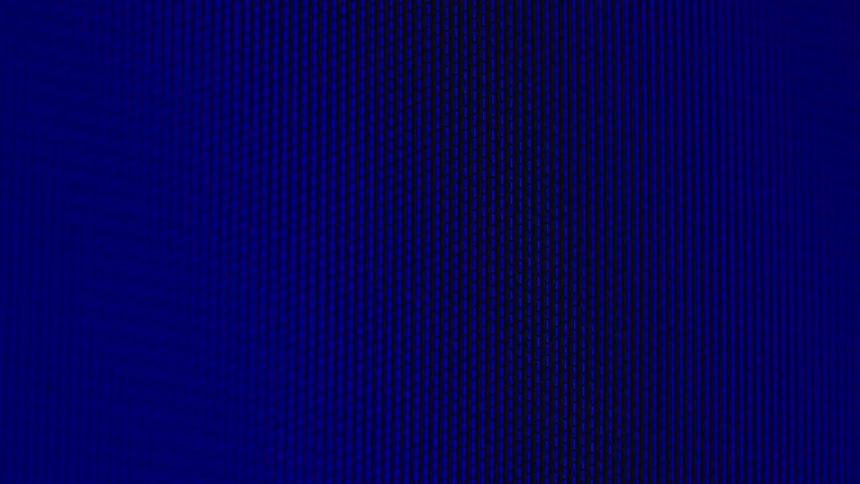 Close-up macro shot of pixelated white hearts floating across a deep blue digital screen