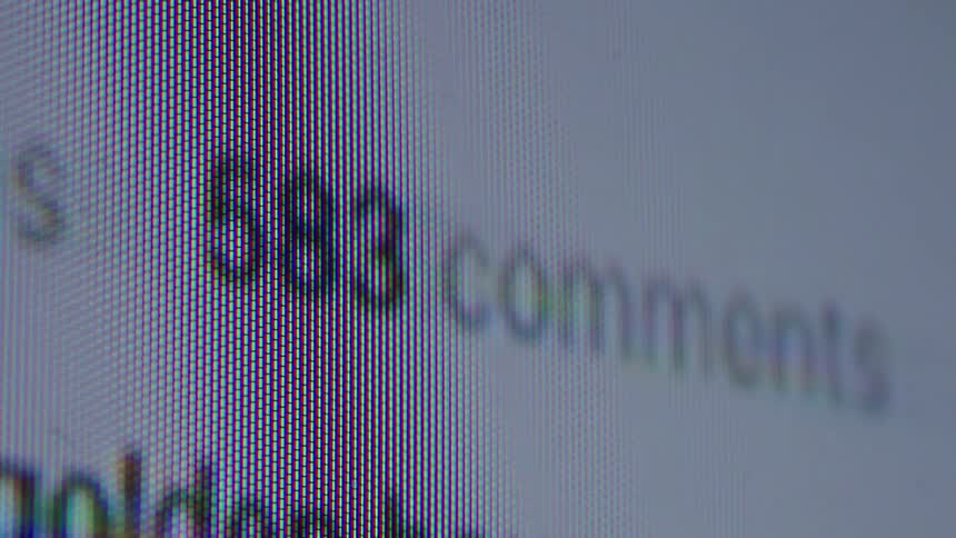 A macro shot of a social media comment counter on a computer screen rapidly increasing, symbolizing viral online engagement