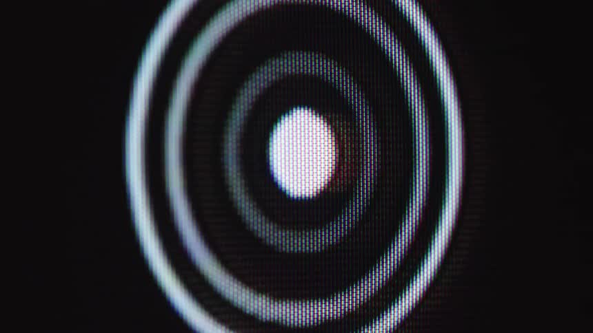 Macro shot of a loading animation on a screen failing and displaying a red 'X' error symbol