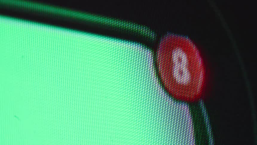 A macro close-up of a red notification counter on a digital screen rapidly increasing its number from zero to twelve