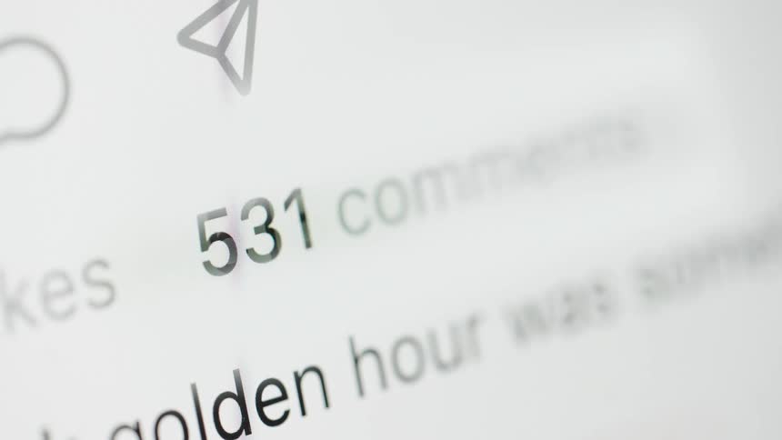 A close up on a social media comment counter as the number of comments rapidly increases, simulating a post going viral