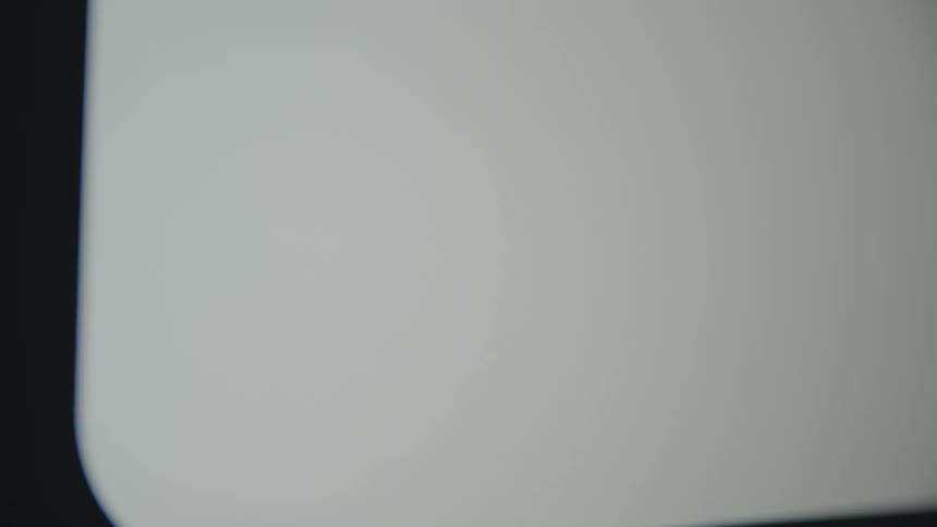 A close-up shot of an animated speech bubble with three dots, indicating that someone is typing a message on a screen