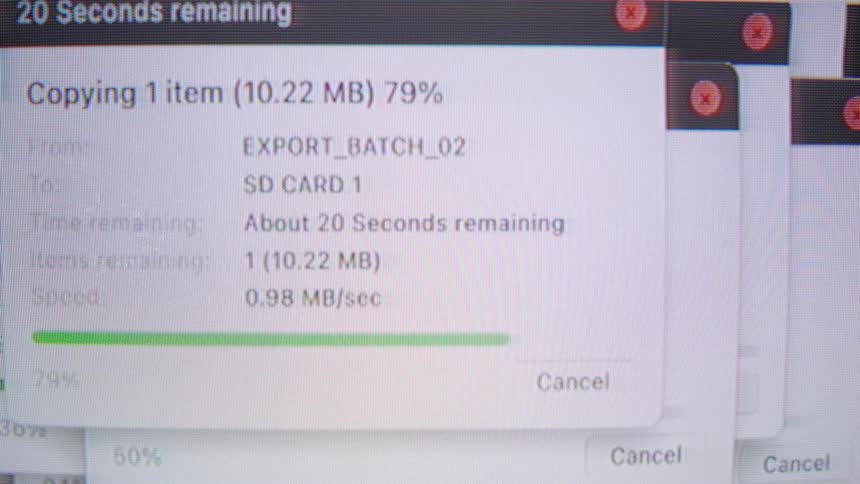 Chaotic montage of multiple data transfer windows showing system files being backed up on a computer screen