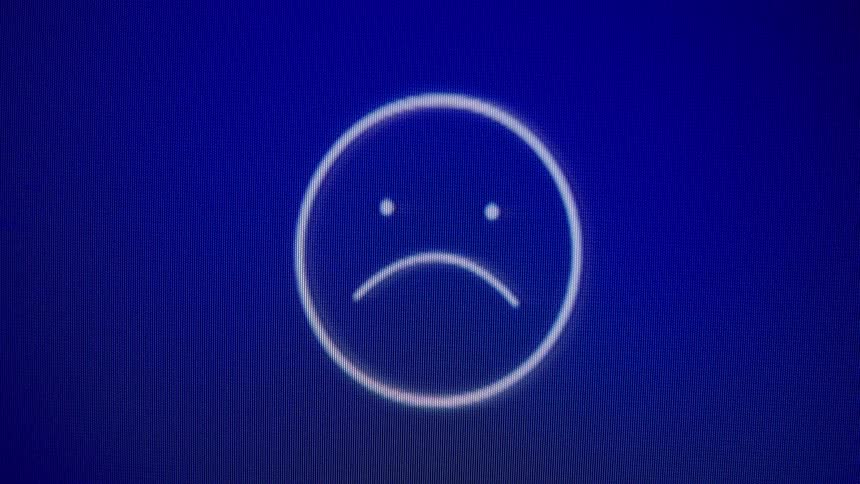 An animated emoji on a blue screen cycles through emotions from sad to happy and back again as it gains and loses heart-shaped likes