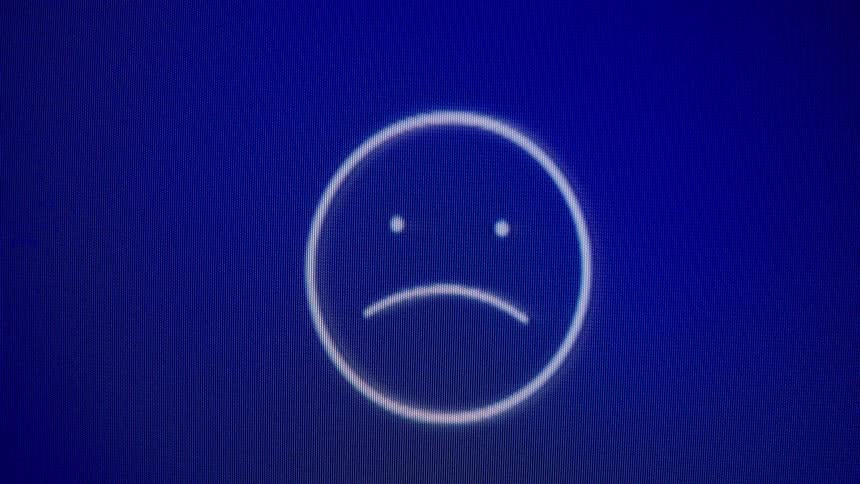 A looping animation of an emoji on a blue screen cycles through sad, neutral, and happy expressions with floating hearts