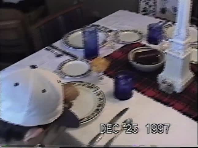 Vintage 1997 home video pans across a beautifully set dining table ready for Christmas dinner