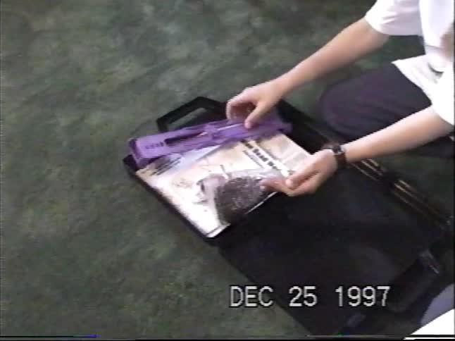 Two young boys open a brand new bead-making craft kit on Christmas morning in 1997