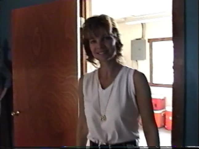 Vintage 1990s home video footage of a family gathering in a basement rec room with a pool table