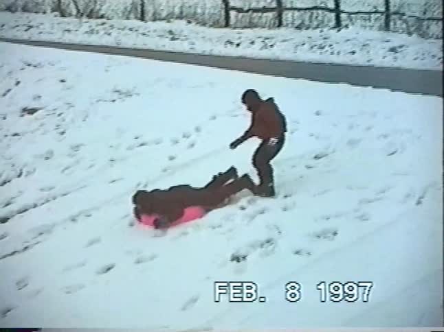Vintage 1997 home video captures a family sledding and tubing together on a snowy winter day
