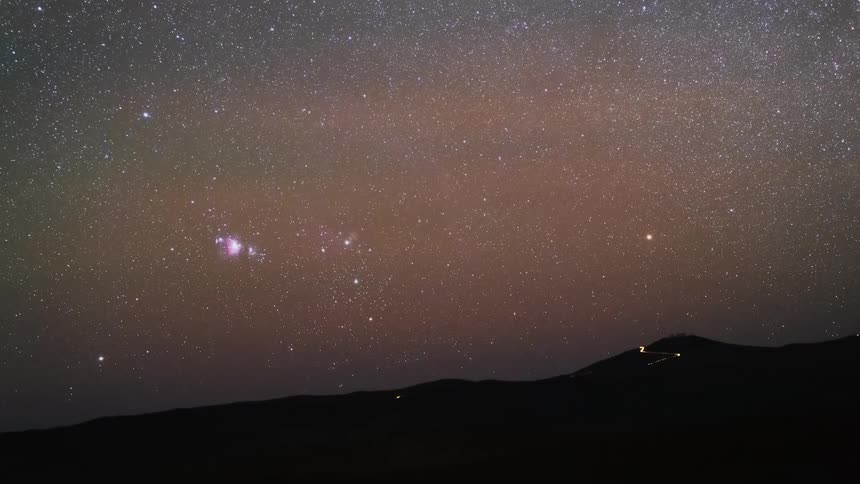 A stunning astrophotography time-lapse zooms out from the Orion Nebula as the starry night sky sets over a mountain range