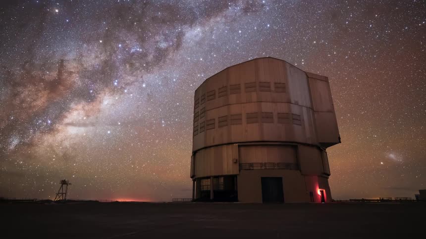 A breathtaking timelapse shows the Milky Way moving across the night sky as a large astronomical observatory opens and rotates to explore the cosmos