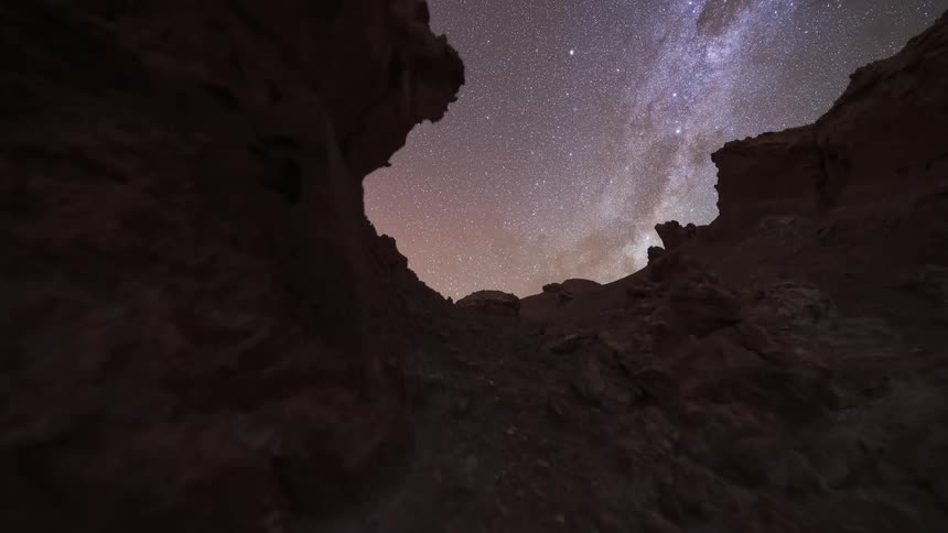 A spectacular day-to-night timelapse from within a desert canyon shows the sunset followed by the Milky Way and a brilliant moonrise