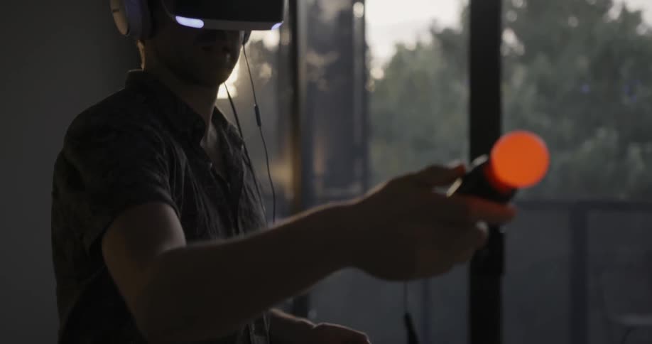 Man looks through a virtual reality machines