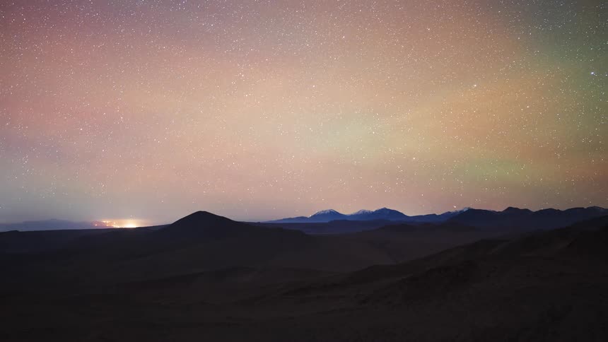 A spectacular full-cycle timelapse from sunset over desert mountains, through a star-filled night with the Milky Way, to a vibrant sunrise