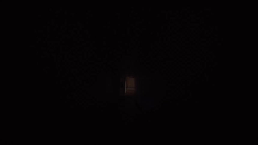 The fluorescent lights in a long, dark, and creepy institutional hallway flicker on and off