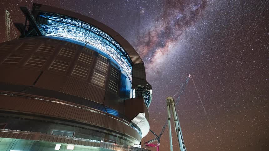A stunning night-to-day timelapse shows the Milky Way galaxy moving across the sky above the construction of a massive observatory dome