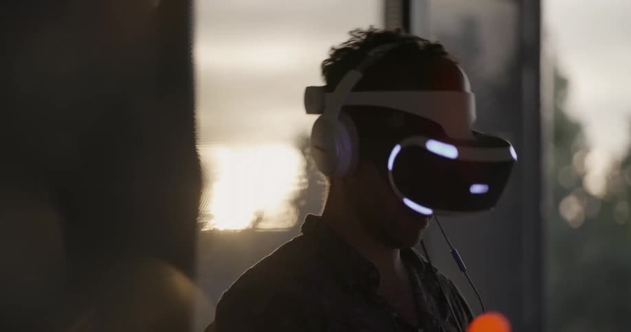 A man swings playing virtual reality