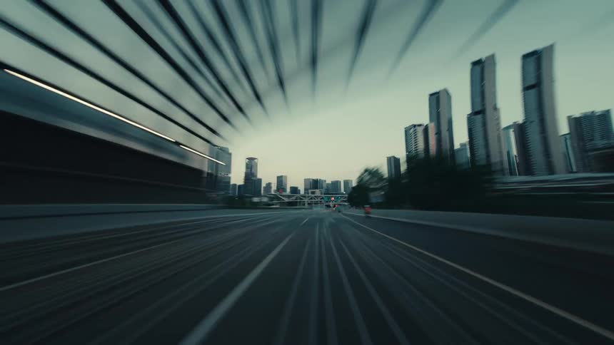 Dynamic POV time-lapse shows a high-speed drive through a futuristic city tunnel and onto the open highway at dusk