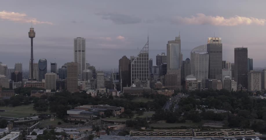 Vehicles drive through a city during the day