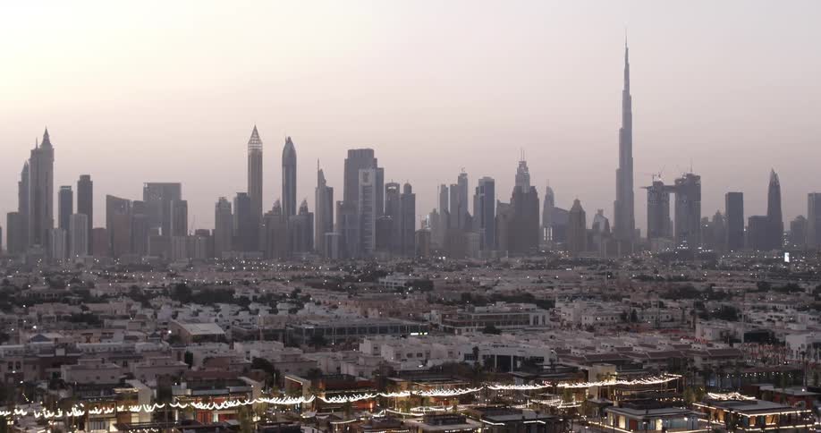 The skyline and aerial view of a coastal city at dawn