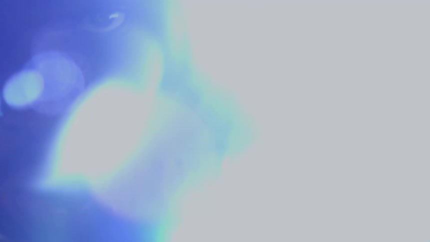 Slow-motion extreme close-up of a boxer's face with dramatic lens flares and heavy breathing