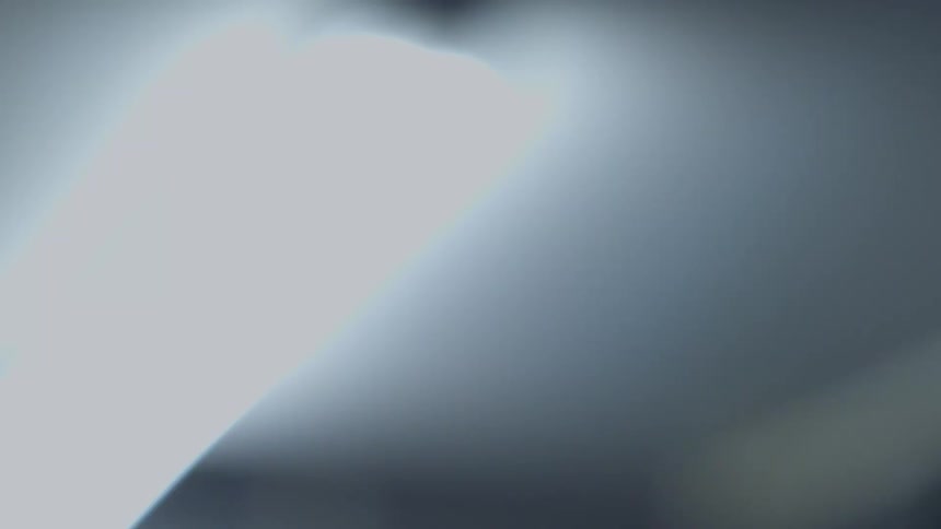 A blurry, low-angle shot shows a fluorescent light fixture flickering on and then slowly fading to complete darkness