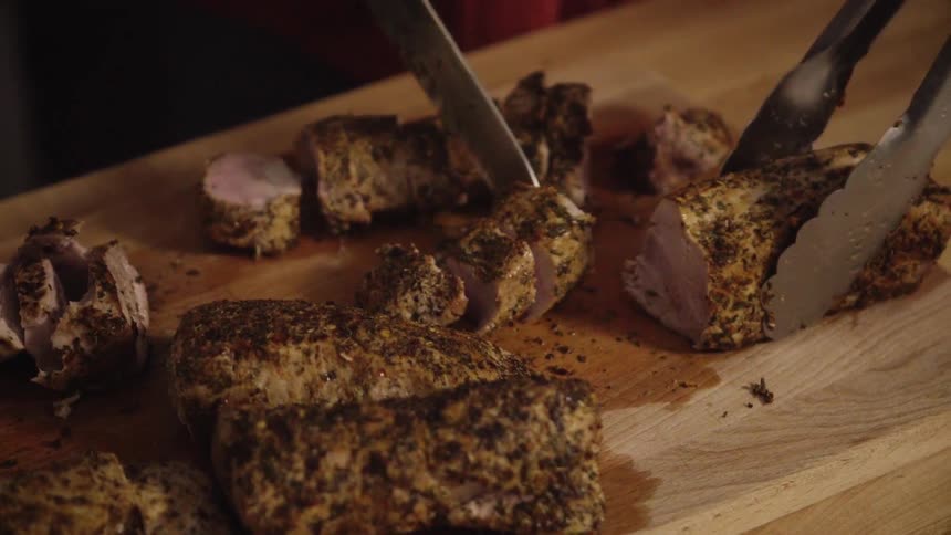 A person is cutting meat