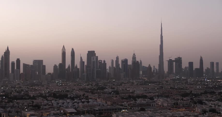 The sun is setting over this large city