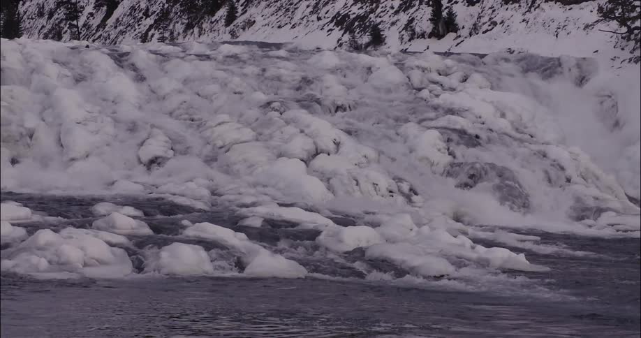 The shore is covered with ice and snow