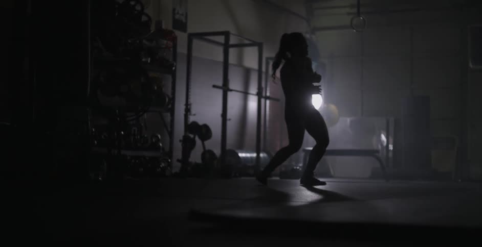 A woman dances in a workout room
