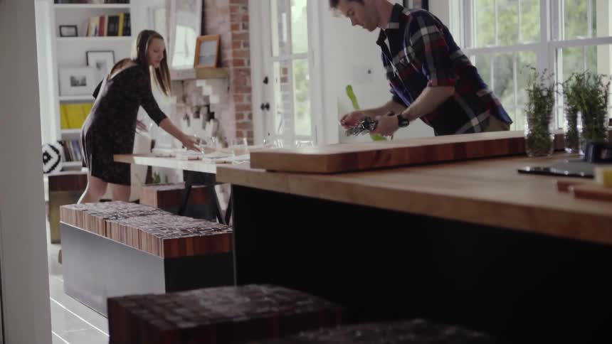 Couple setting a table in preparation of a meal