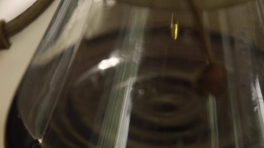 Liquid drips in a flask
