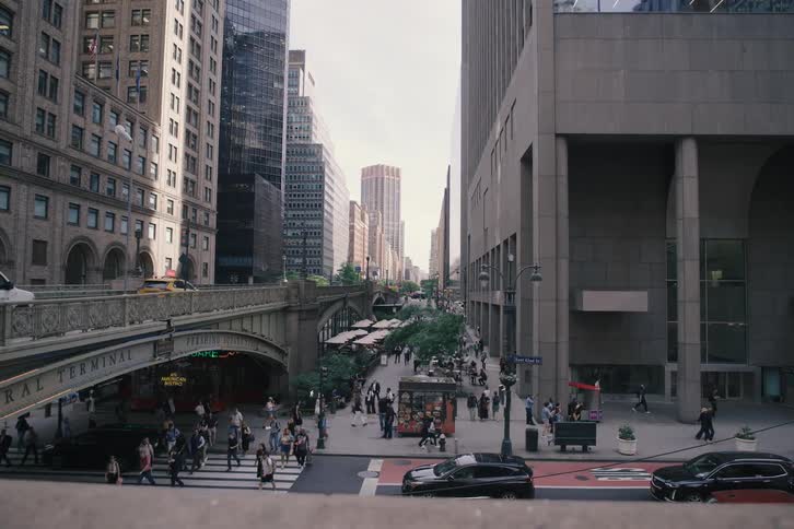 A slow pan reveals the bustling street below the Pershing Square Viaduct next to Grand Central Terminal in New York City