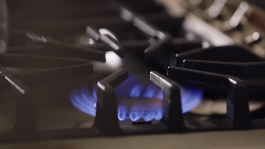 Burner igniting and a pan is placed on it