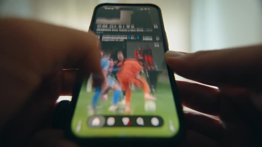 A dramatic point-of-view shot of a person's hands rapidly scrolling through a social media feed on a smartphone