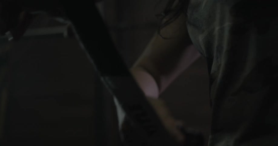 A woman is preparing to workout in a gym