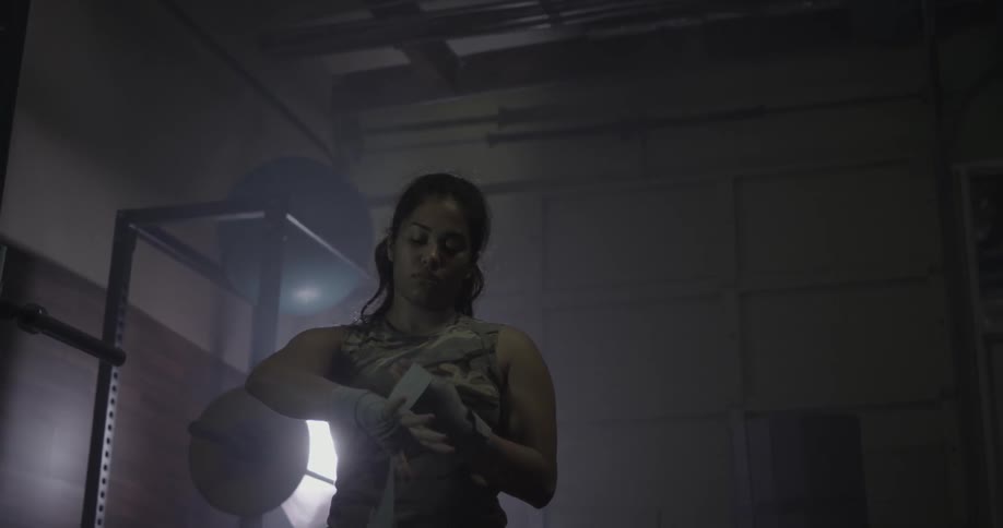 A woman wraps her wrists and fists