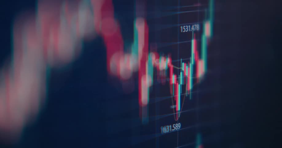 An abstract, out-of-focus close-up of a digital candlestick stock market chart shows financial data fluctuating over time