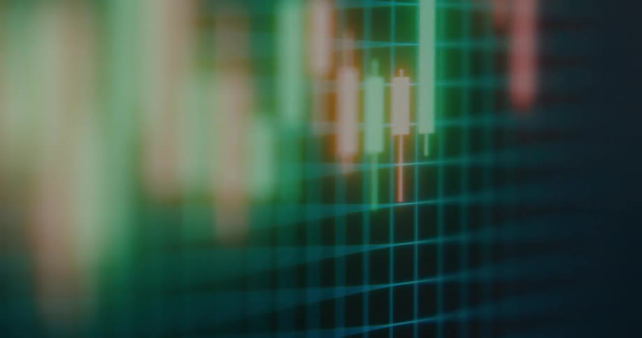 An abstract, out-of-focus animation shows a volatile candlestick chart with red and green bars moving on a digital grid
