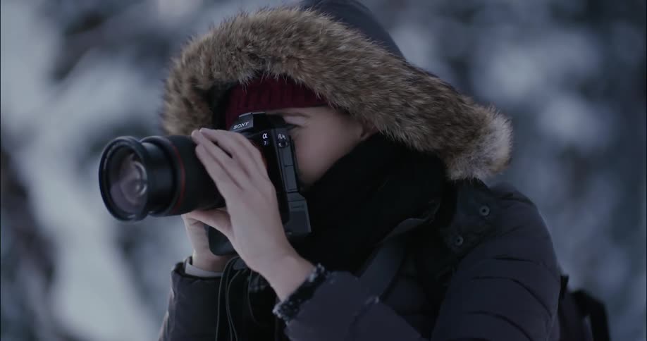 A woman is taking photographs