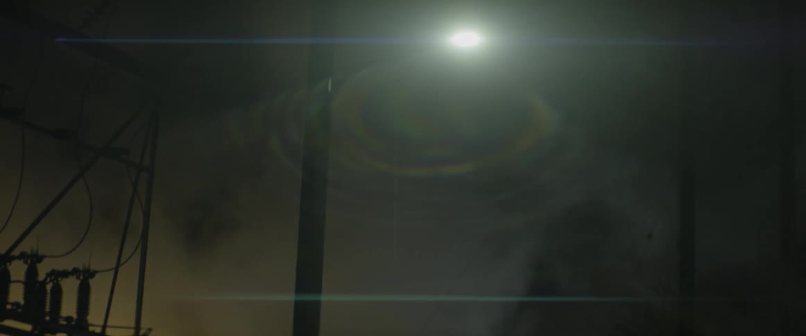 A light shines in a foggy area