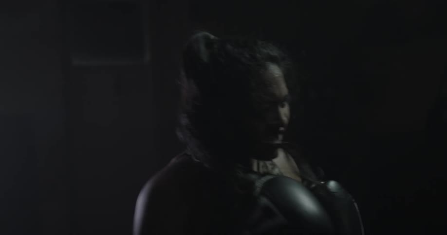 Woman boxer training with another boxer