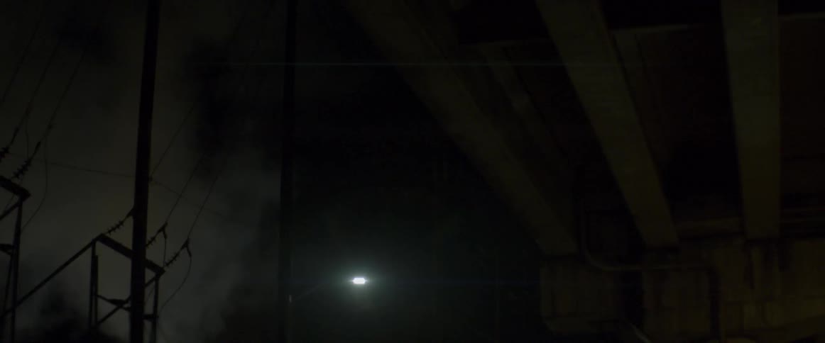 A single light is in a dark area