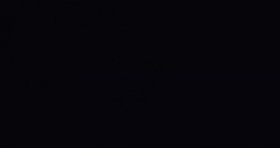Dramatic lightning flashes illuminate the dark, stormy night sky with powerful bolts of electricity