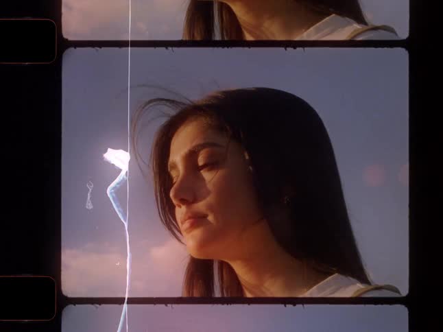 A dreamy portrait of a beautiful young woman in a vintage film strip style as she stands outdoors at golden hour