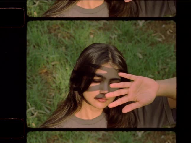 Vintage-style split-screen film footage of a young woman shielding her eyes from the sun in a grassy park